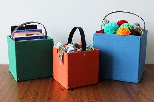 Decoupage cardboard boxes with recycled belts for storage