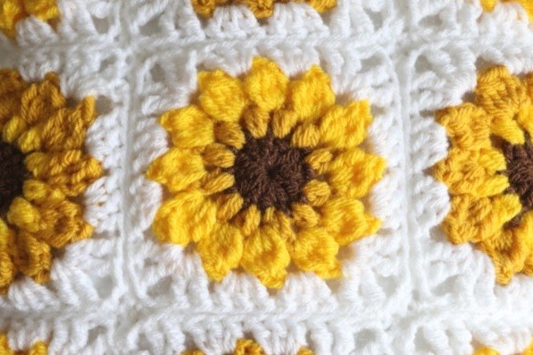 Helping our users. Granny Square with Sunflower Crochet Motif. Helping our users. Granny Square with Sunflower Crochet Motif.