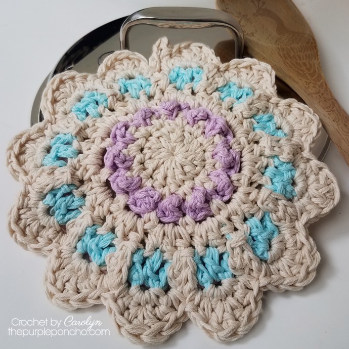 Create a Beautiful and Functional Handmade Crochet Potholder with Floral Berry Design for Your Kitchen