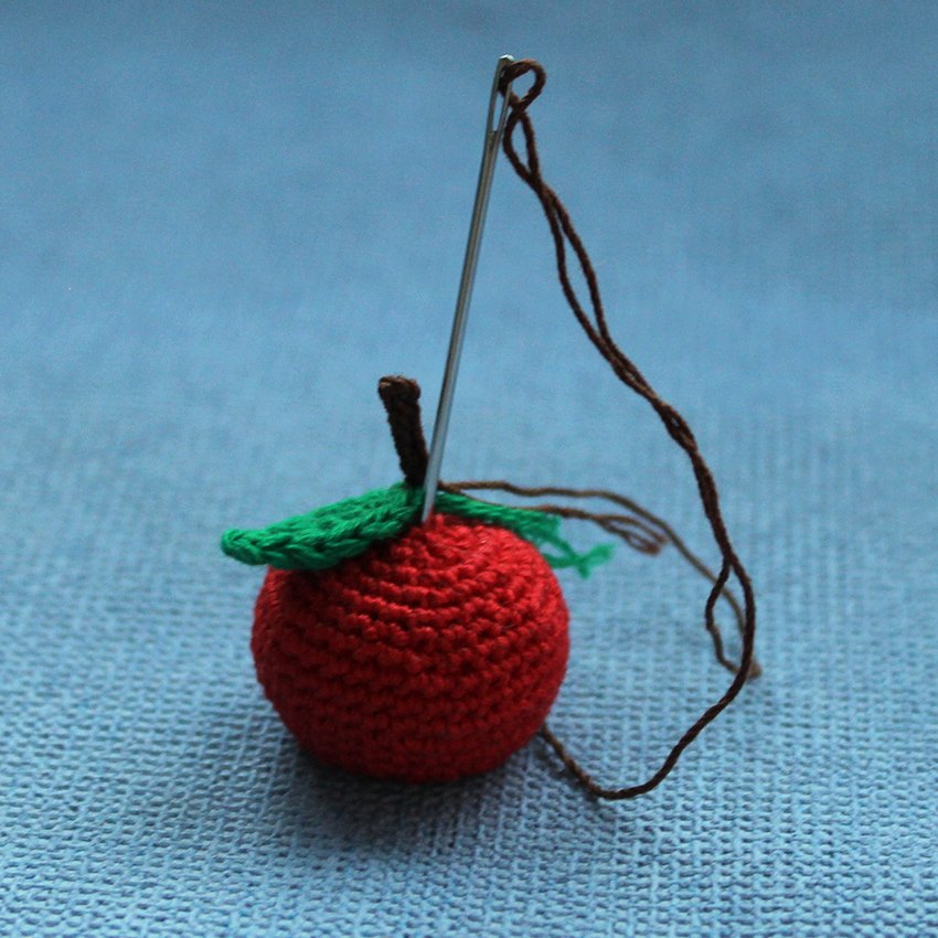 Create Whimsical Crochet Apple and Worm Pencil Decor for Your Workspace